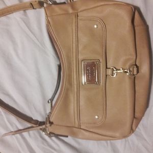 A purse by Nicole Miller.